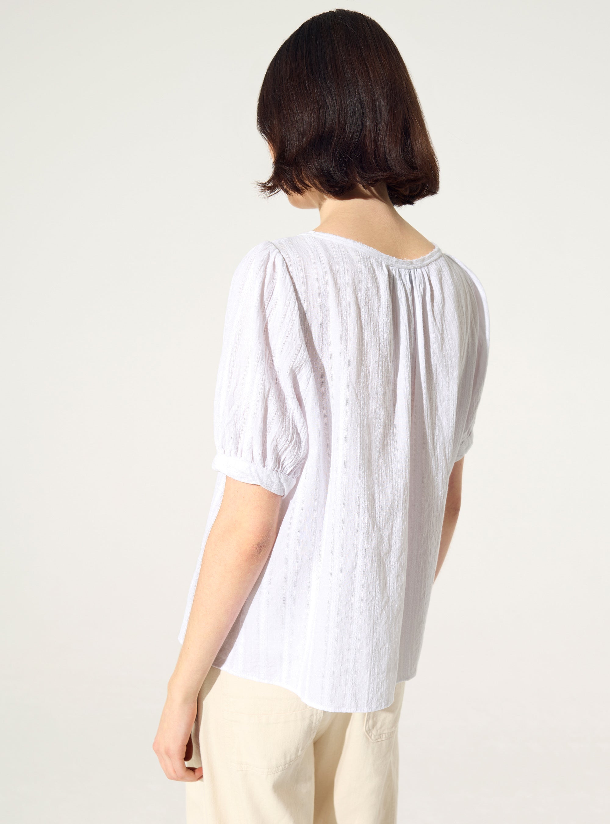 Loose-fitting white cotton blouse