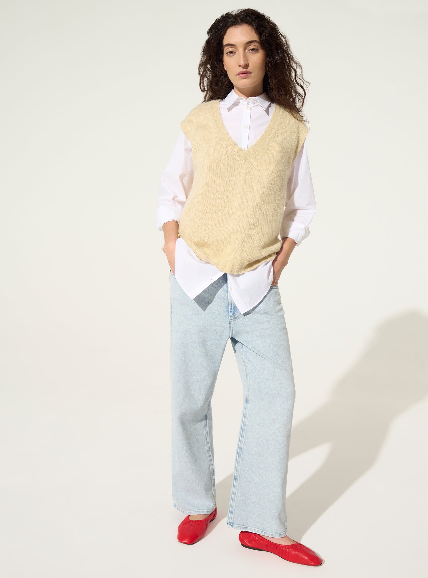 White sleeveless sweater