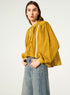 Oversized pleated shirt and ochre yellow Calais-Caudry® lace